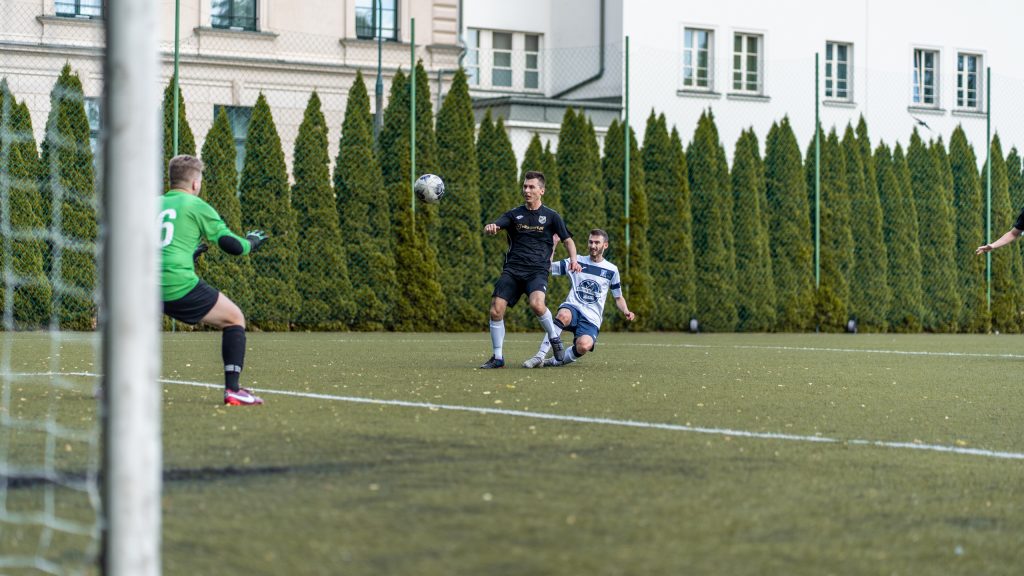 Yuri Samyonov of Krakow Dragoons FC attempts shot at goal vs Wawel