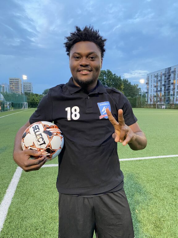 Isreal Olusoji of Krakow Dragoons FC giving thumbs up for a roster picture