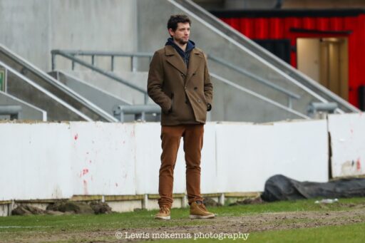 Krakow Dragoons FC head coach Hugo Cruz observing the match vs FC United of Manchester from the dugout